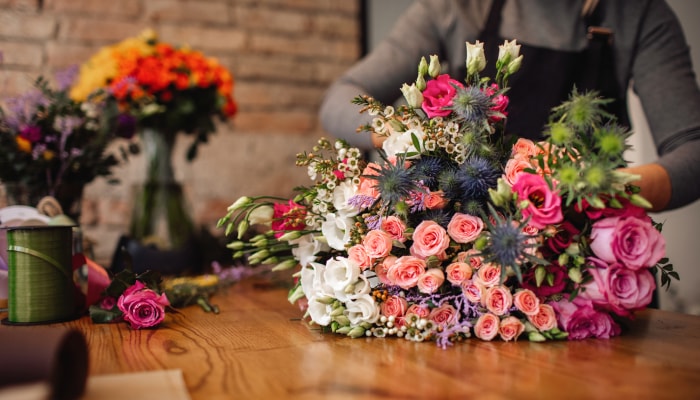 Florist preparing a large bouquet